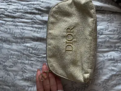 Neceser dorado Dior elegante - miniatura 1