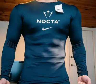 Polera deportiva Nike Nocta Negra - miniatura 1