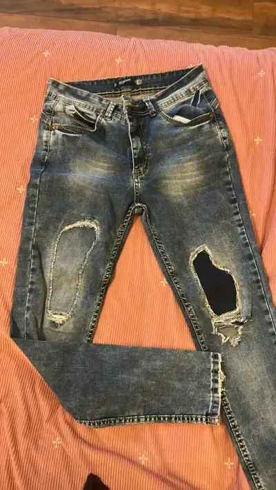 Jeans desgastados de mezclilla azul - miniatura 1
