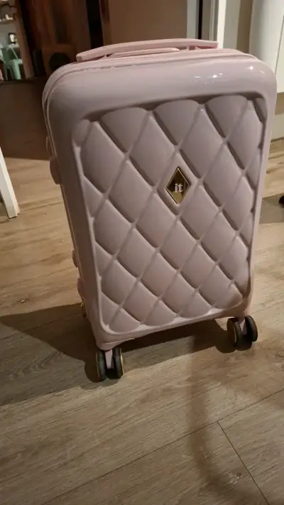 Maleta rosada con diseño acolchado - miniatura 1