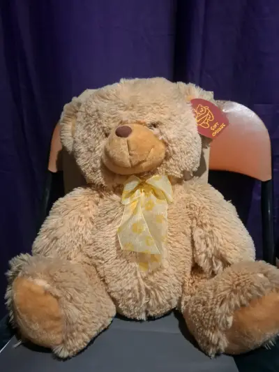 Osito de peluche con lazo amarillo - miniatura 1
