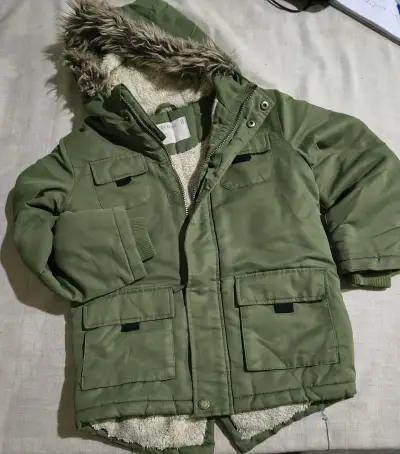 Parka verde con capucha de piel sintética - miniatura 1