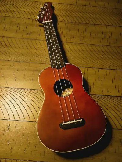 Ukulele acústico de madera color marrón - miniatura 4