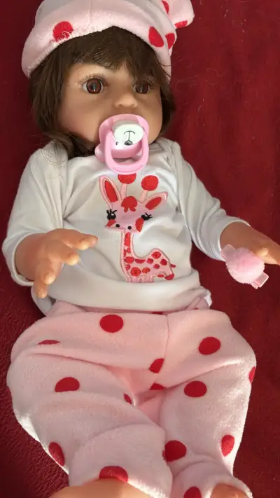 Muñeca bebé con chupete y pijama - miniatura 1