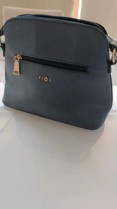 Cartera azul elegante con detalle dorado - miniatura 2