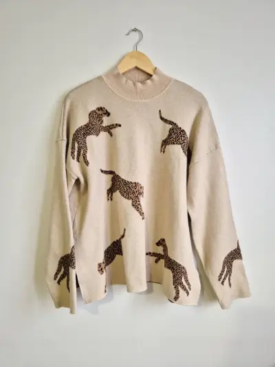 Suéter beige con estampado de leopardos - miniatura 1