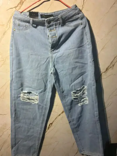 Jeans celestes desgastados para mujer - miniatura 1
