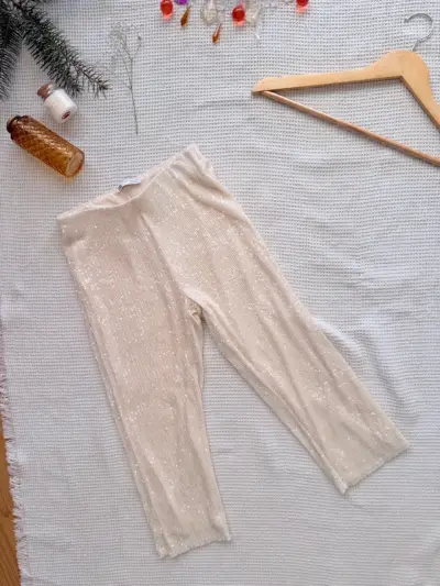 Pantalones de lentejuelas beige elegantes - miniatura 1