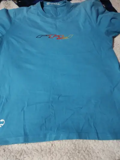 Polera celeste con logo Fly Racing - miniatura 1