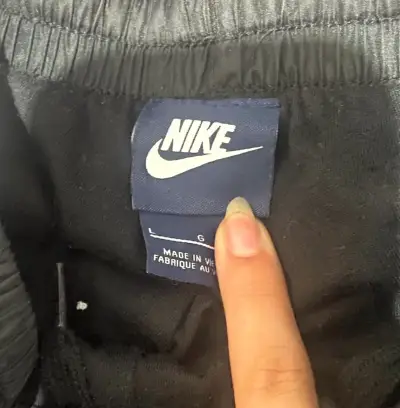 Pantalones deportivos Nike azul con franjas - miniatura 2