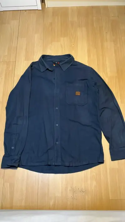 Camisa azul Kaya unite con bolsillo - miniatura 1