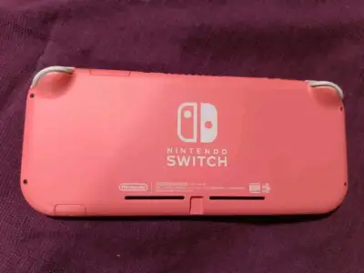 Nintendo Switch Lite coral con juego Animal Crossing - miniatura 4