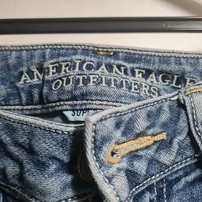 Jeans desgastados de mezclilla azul - miniatura 2