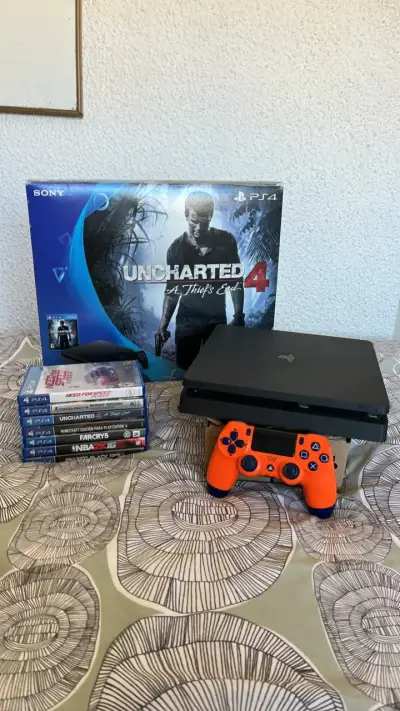 Consola PS4 con juegos y control naranja - miniatura 1
