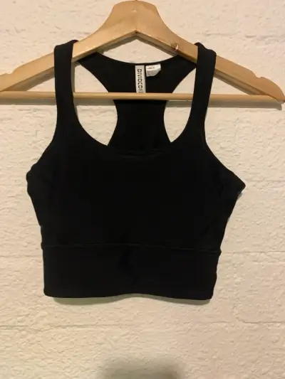 Top deportivo negro Divided HYM - miniatura 1