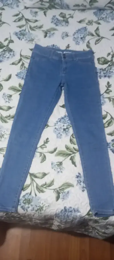 Jeans ajustados azul claro para mujer - miniatura 1