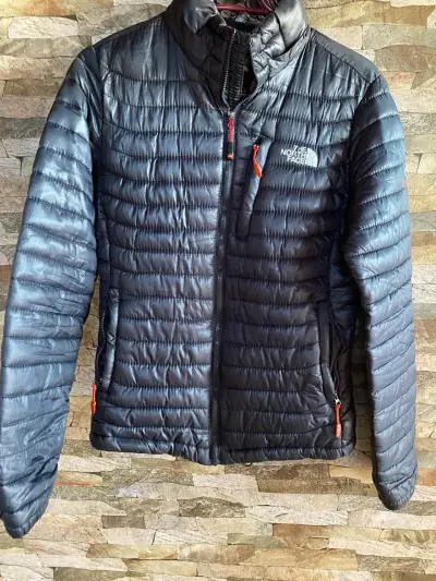 Chaqueta The North Face azul acolchada - miniatura 1