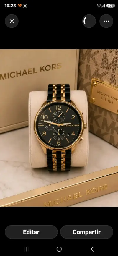 Reloj Michael Kors dorado y negro - miniatura 1