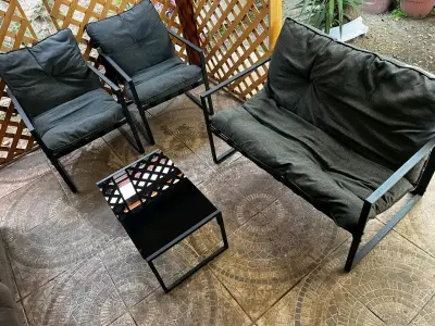 Juego de muebles de terraza con cojines negros - miniatura 1