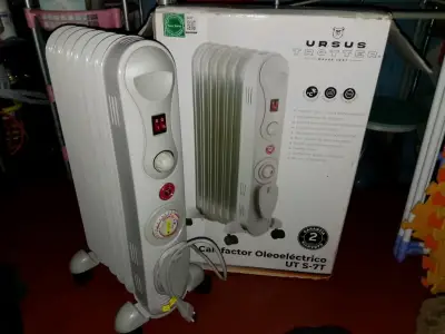 Calefactor oleoeléctrico Ursus Trotter UT S-7T - miniatura 1