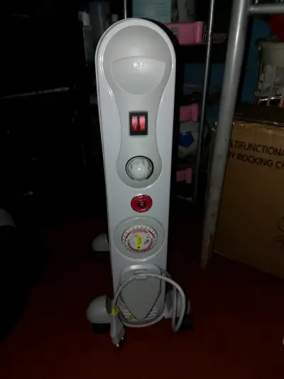 Calefactor oleoeléctrico Ursus Trotter UT S-7T - miniatura 2