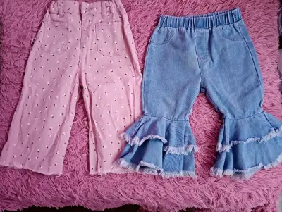 Pantalones infantiles rosa y azul con volantes - miniatura 1