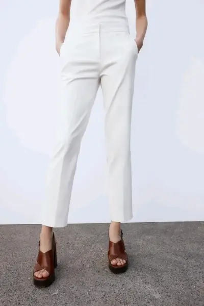 Pantalones blancos elegantes para mujer - miniatura 1