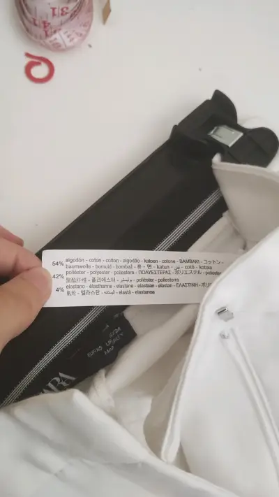 Pantalones blancos elegantes para mujer - miniatura 4