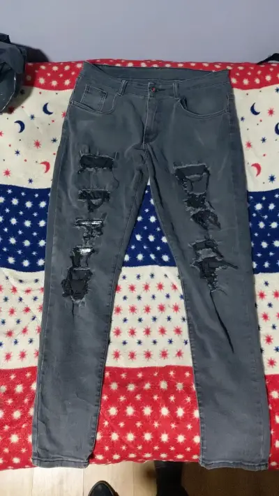 Jeans grises rotos estilo casual - miniatura 1