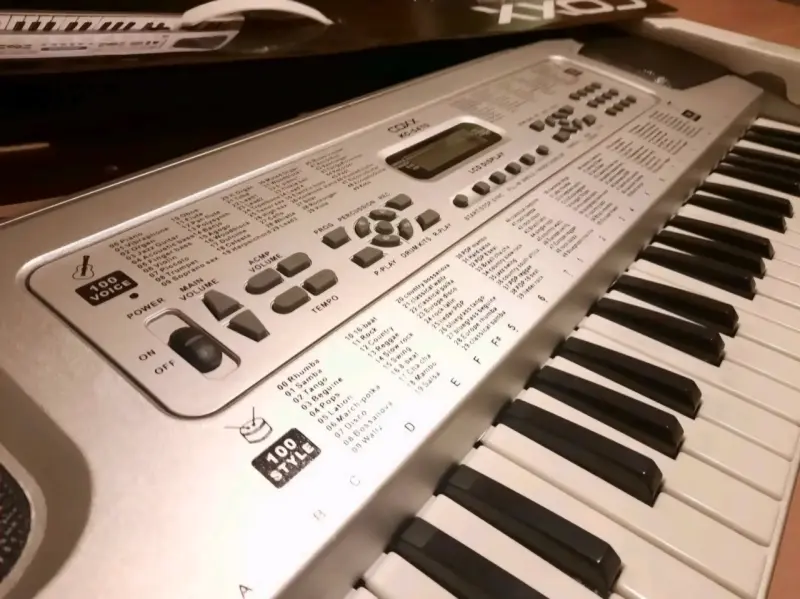 Teclado electrónico Coxx con 100 ritmos - 1