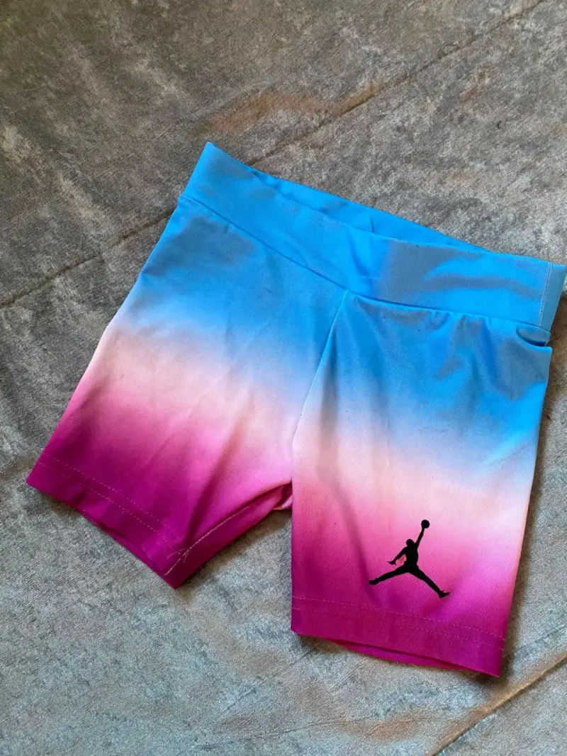Shorts deportivos Jordan degradé azul y rosa