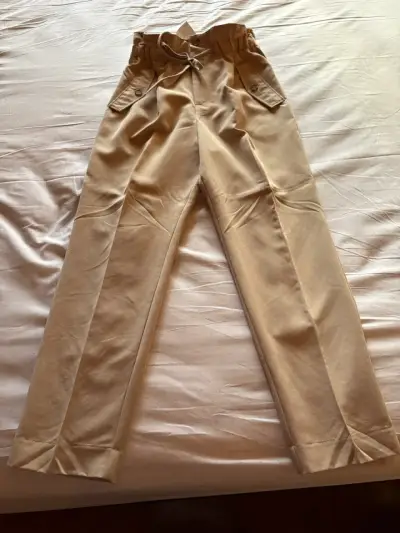 Pantalones de lino beige con bolsillos laterales - miniatura 1