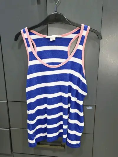 Polera sin mangas a rayas azul y blanca - miniatura 1