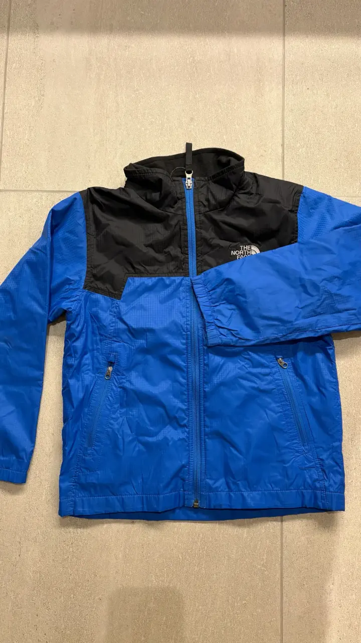 Chaqueta impermeable The North Face azul y negra - 1