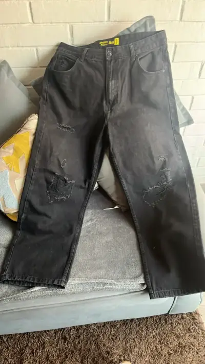 Jeans negros desgastados para hombre - miniatura 1