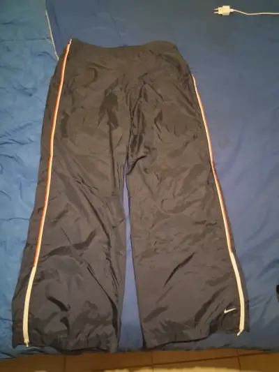 Pantalones deportivos Nike azul marino con franjas - miniatura 1