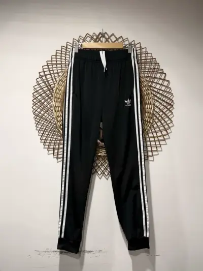 Pantalones deportivos Adidas negros con franjas - miniatura 1