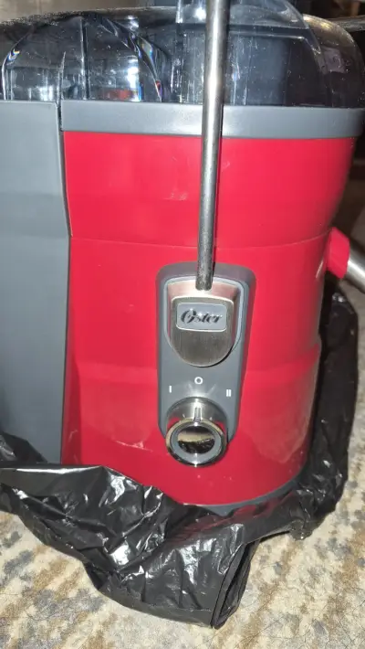 Extractor de jugos Oster rojo y gris - miniatura 3