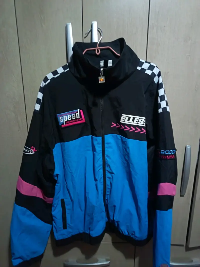 Chaqueta deportiva vintage Ellesse azul y negra
