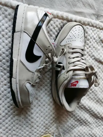 Zapatillas Nike Dunk Low blancas y negras - miniatura 1