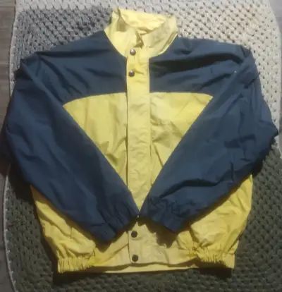 Chaqueta cortaviento bicolor amarillo y azul - miniatura 1