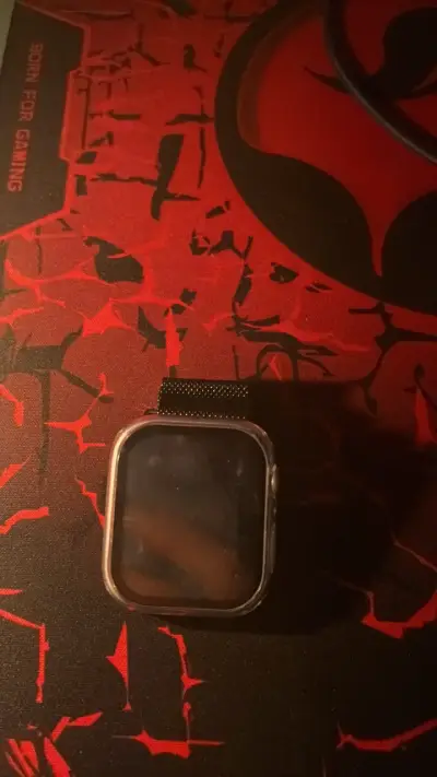 Apple watch serie 4 con correa de malla negra - miniatura 1