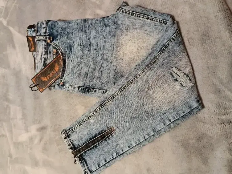 Jeans desgastados azul claro con cierre - 1