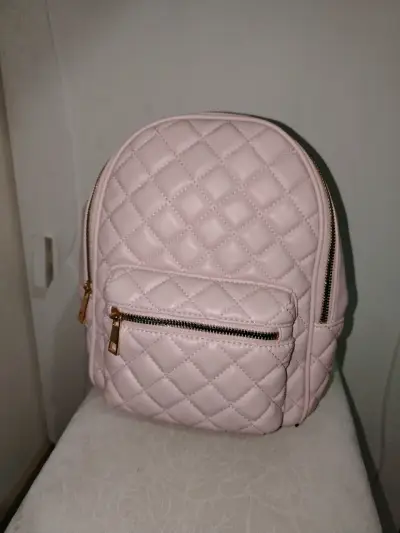 Mochila rosada acolchada con bolsillo frontal - miniatura 1