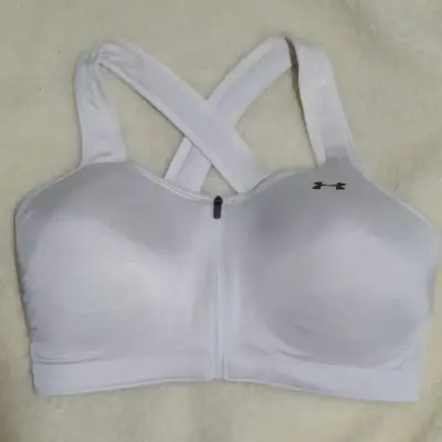 Sostén deportivo Under Armour blanco con cierre. - miniatura 1