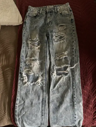 Jeans desgastados de mezclilla azul - miniatura 1