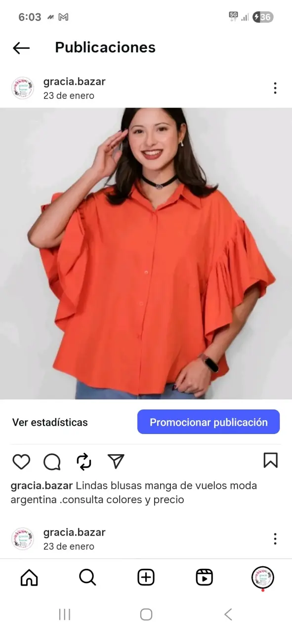 Blusa naranjay negra con mangas de vuelo y - 1