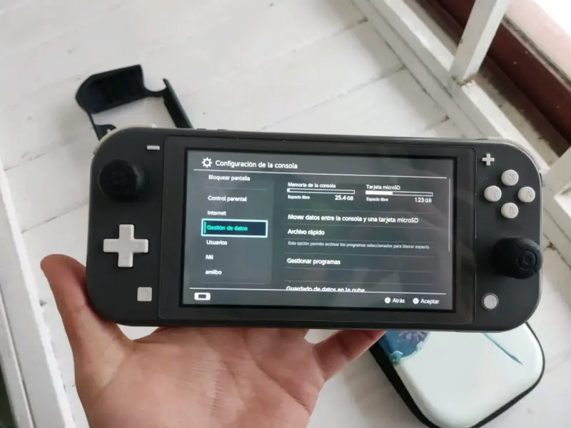 Nintendo switch lite negra con magia - 2