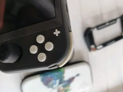 Nintendo switch lite negra con magia - miniatura 4