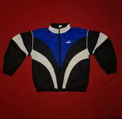 Chaqueta deportiva Puma azul y negra - miniatura 1